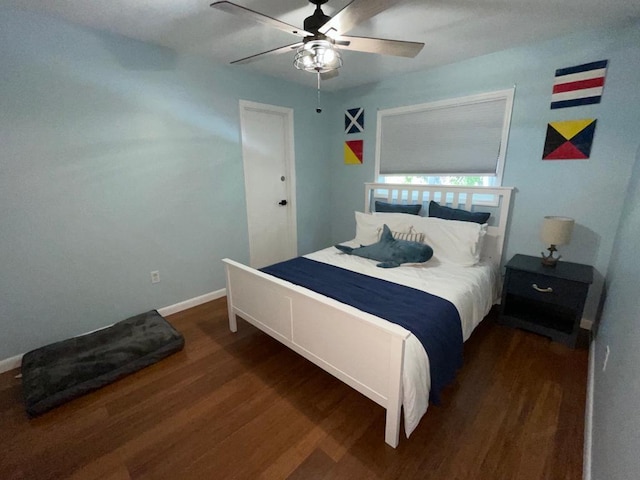 bedroom featuring dark wood-type flooring and ceiling fan