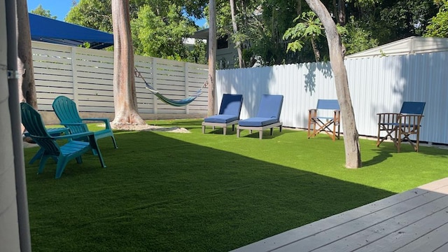 view of yard with a wooden deck