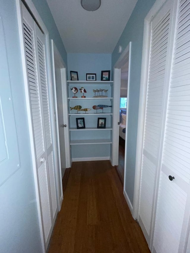 hall with dark hardwood / wood-style flooring