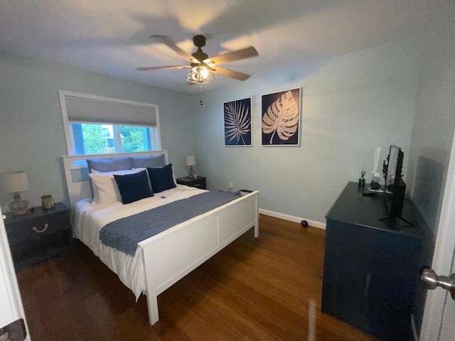 bedroom featuring dark hardwood / wood-style floors and ceiling fan