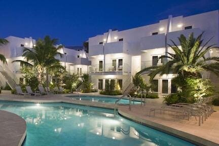 pool at twilight featuring a patio