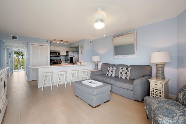 500 Burton Dr Unit 5307, Key Largo, FL 33070 - living area featuring light wood-style floors and rail lighting