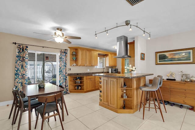 634 Ponce De Leon Blvd, Key Largo, FL 33037 - kitchen featuring open shelves, range hood, a kitchen bar, and healthy amount of natural light