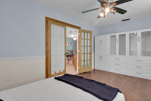 634 Ponce De Leon Blvd, Key Largo, FL 33037 - bedroom with dark wood-style flooring and ceiling fan