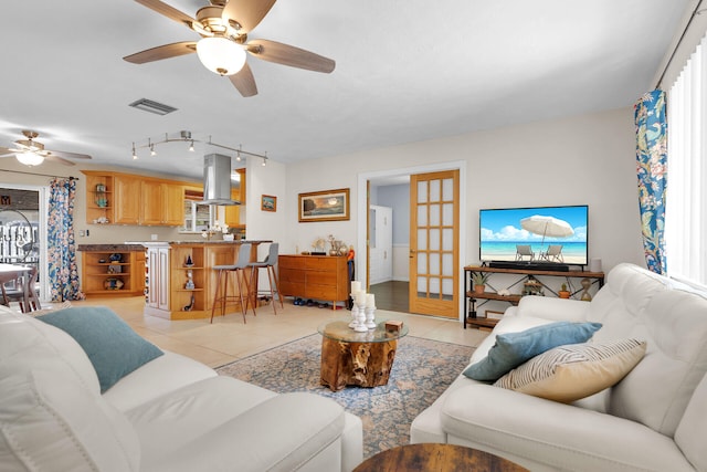 634 Ponce De Leon Blvd, Key Largo, FL 33037 - living area featuring a ceiling fan, light tile patterned floors, and track lighting