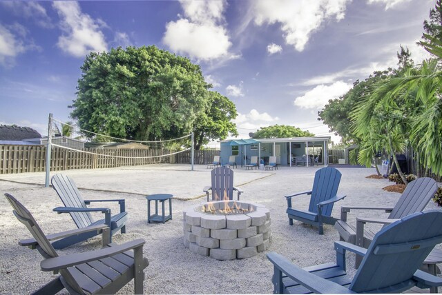 view of patio featuring volleyball court and an outdoor fire pit