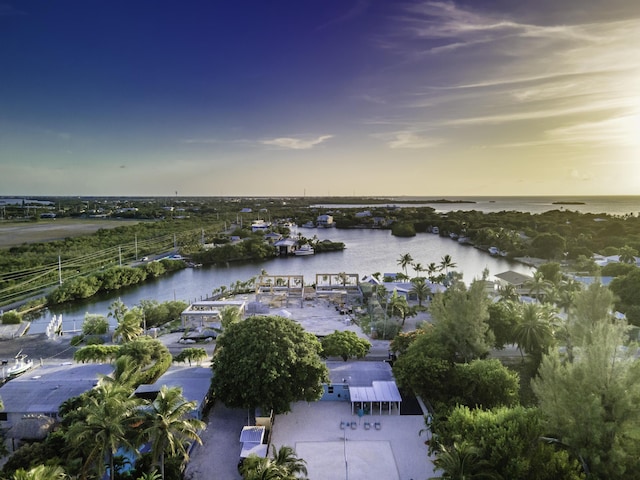 aerial view at dusk with a water view