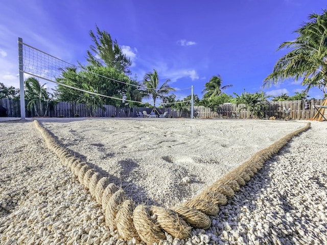 view of home's community featuring volleyball court