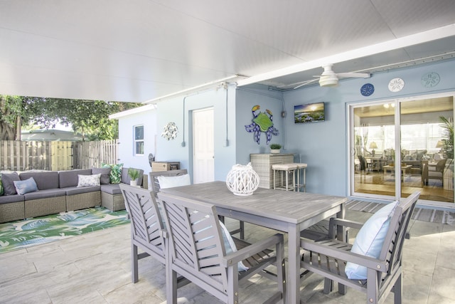 view of patio with ceiling fan and outdoor lounge area