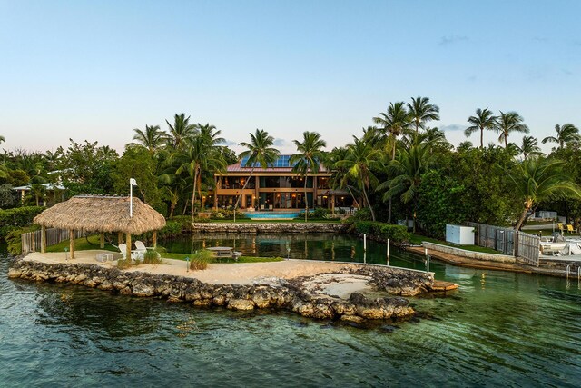 exterior space with a gazebo and a water view