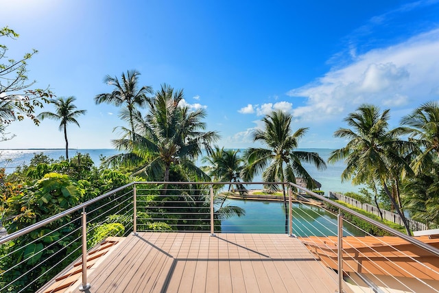 view of swimming pool featuring a water view