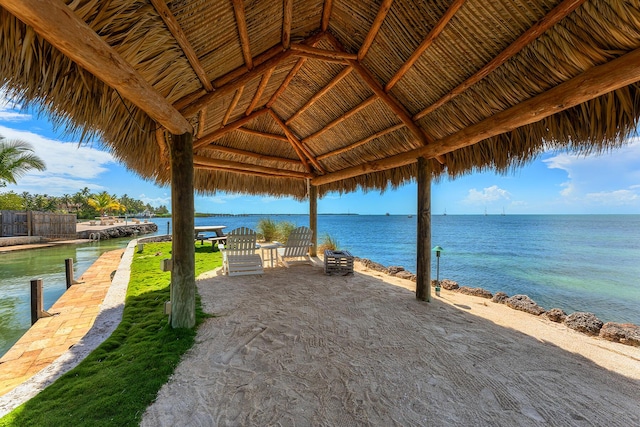 exterior space featuring a gazebo and a water view