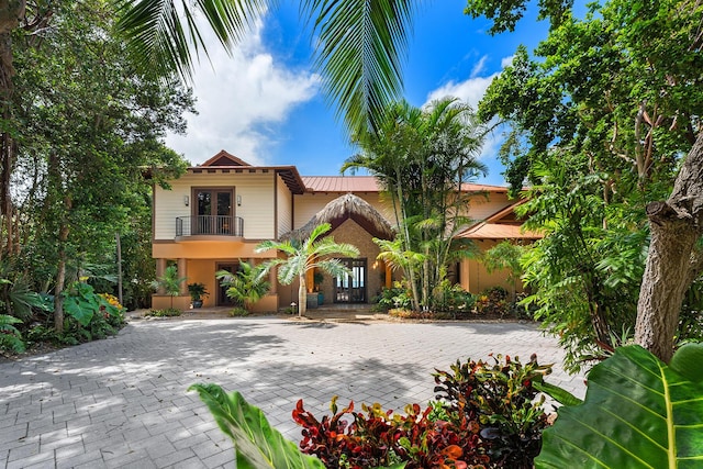 view of front of house with a balcony