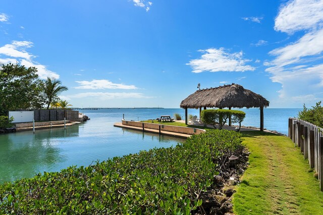 dock area featuring a gazebo and a water view