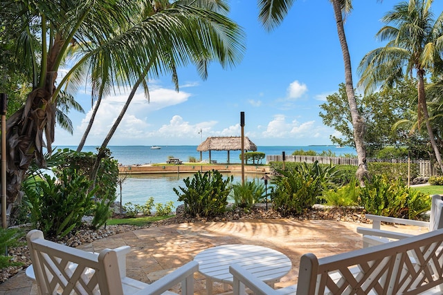 view of patio featuring a water view and a gazebo