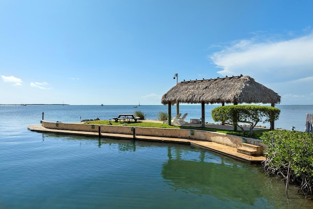 dock area with a gazebo and a water view