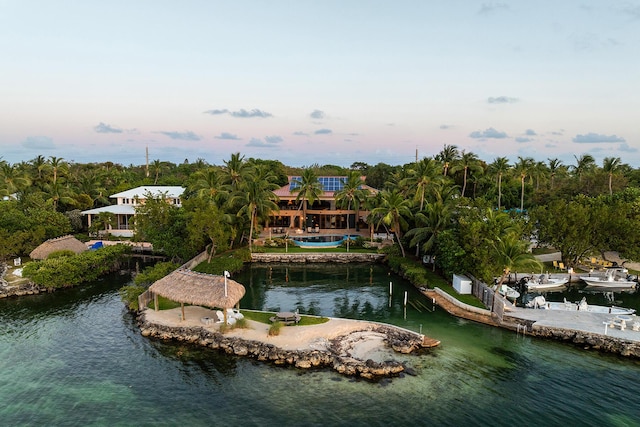 aerial view at dusk with a water view