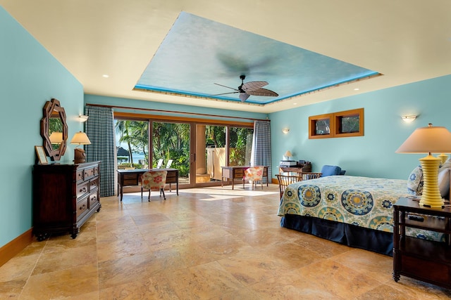 bedroom with a tray ceiling