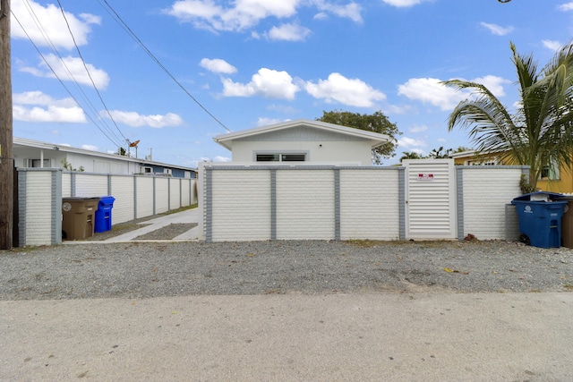 garage with fence and a gate