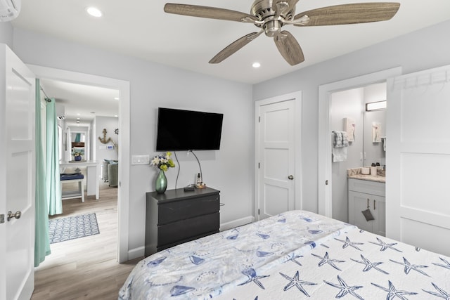 bedroom with ceiling fan, ensuite bathroom, recessed lighting, baseboards, and light wood-style floors