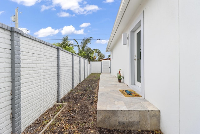 view of yard featuring a patio area and a fenced backyard