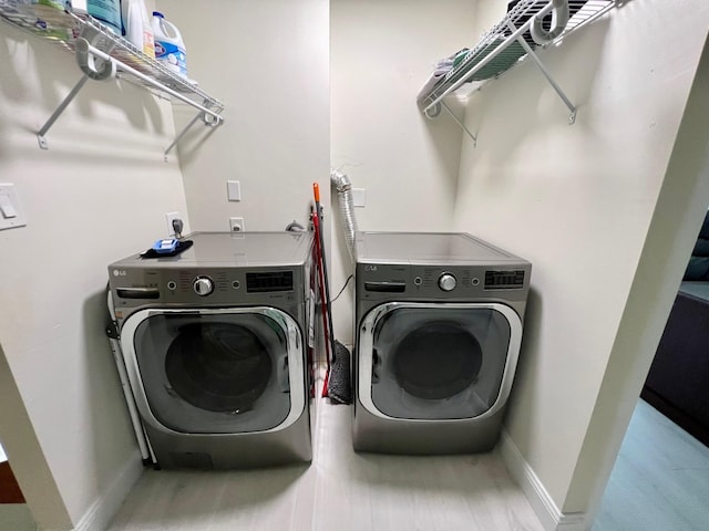 laundry room with washer and clothes dryer