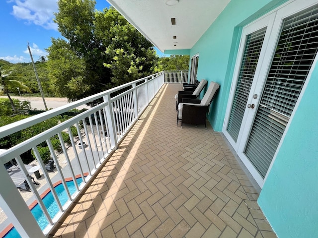 balcony featuring french doors