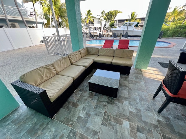 view of patio / terrace with outdoor lounge area and a fenced in pool