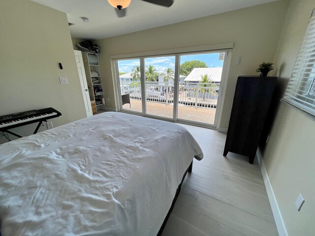 bedroom with access to outside, ceiling fan, and light hardwood / wood-style flooring