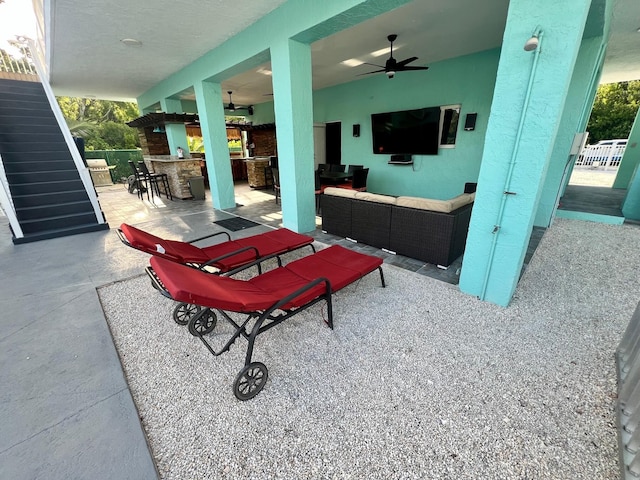 view of patio / terrace with ceiling fan, exterior bar, and an outdoor hangout area