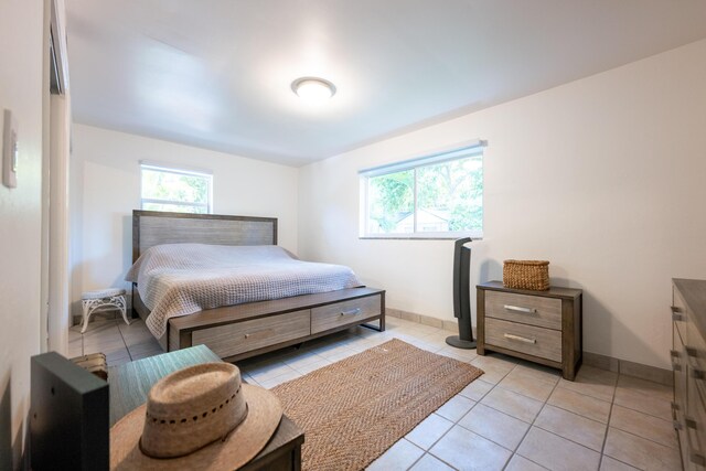 bedroom featuring light tile patterned floors