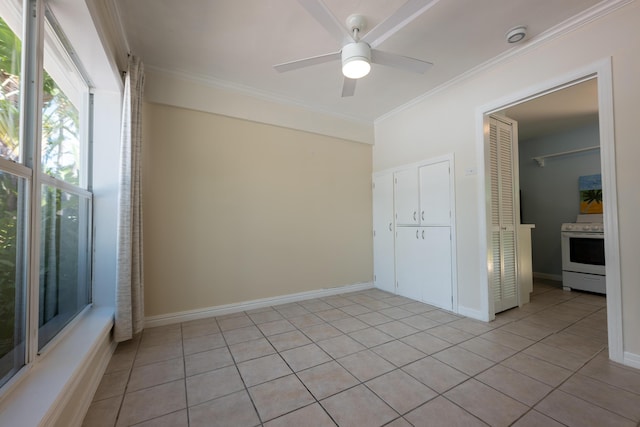 tiled spare room with crown molding and ceiling fan