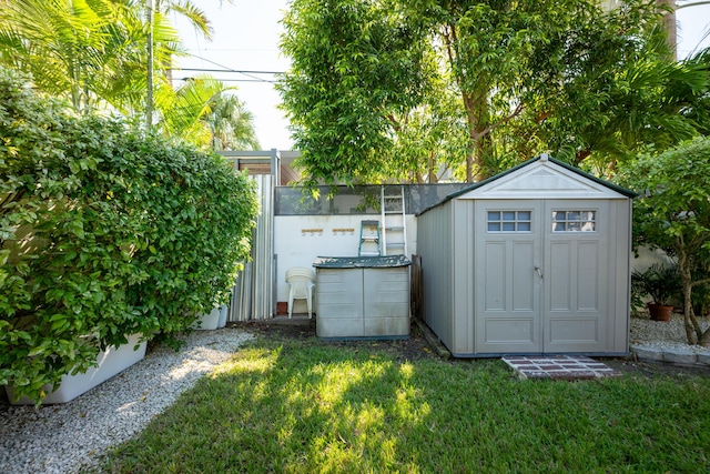 view of outdoor structure with a lawn