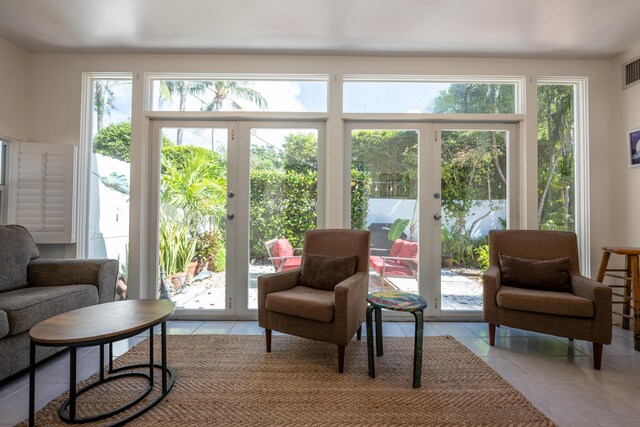 doorway featuring french doors and light tile patterned flooring