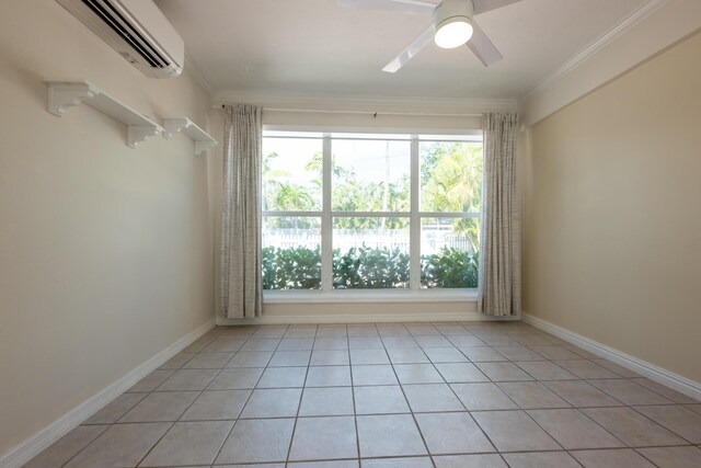 spare room featuring light tile patterned floors, crown molding, an AC wall unit, and ceiling fan