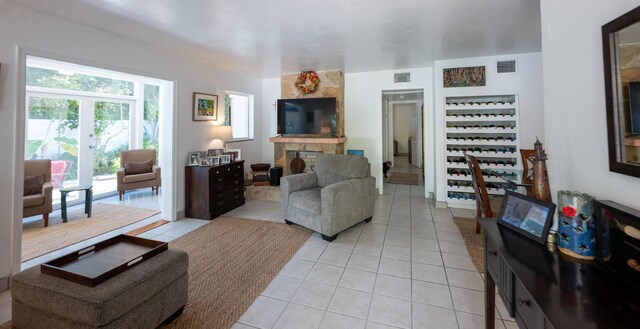 tiled living room featuring french doors