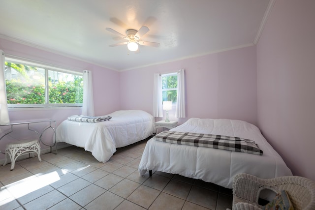 bedroom featuring crown molding, ceiling fan, multiple windows, and light tile patterned floors