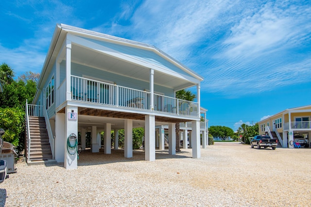 coastal inspired home featuring a carport