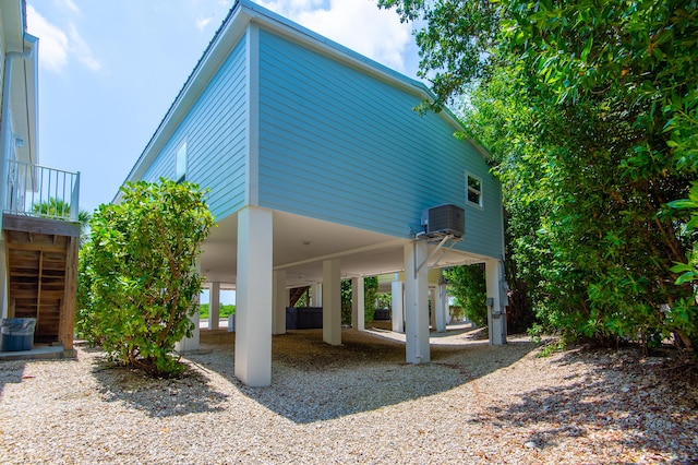 view of property exterior featuring a carport