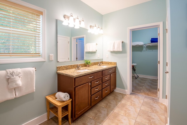 bathroom featuring tile patterned flooring and vanity