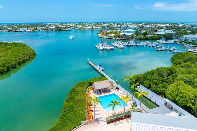 birds eye view of property with a water view