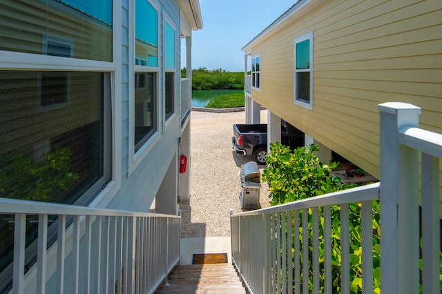 view of side of home with a water view