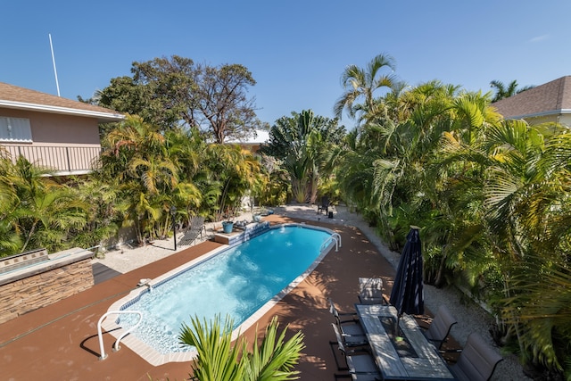 pool featuring a patio area