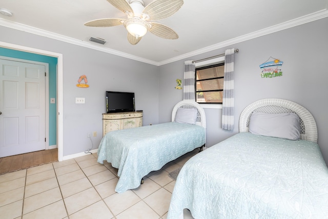 bedroom featuring light tile patterned floors, visible vents, baseboards, a ceiling fan, and ornamental molding