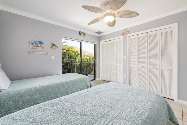 tiled bedroom with visible vents, baseboards, access to outside, crown molding, and multiple closets