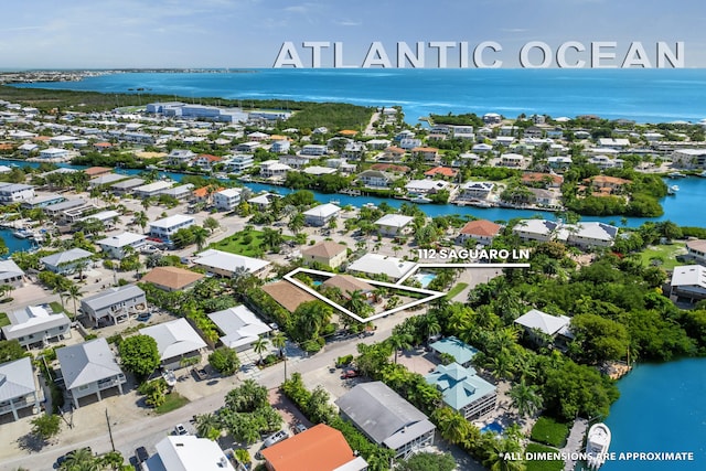 aerial view with a water view and a residential view