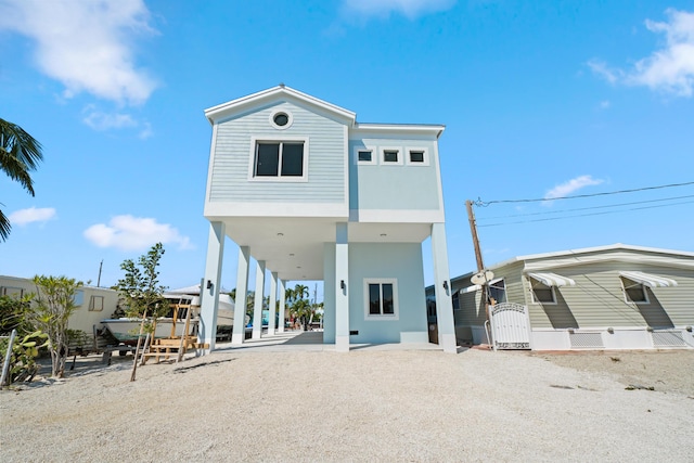 back of property featuring a carport