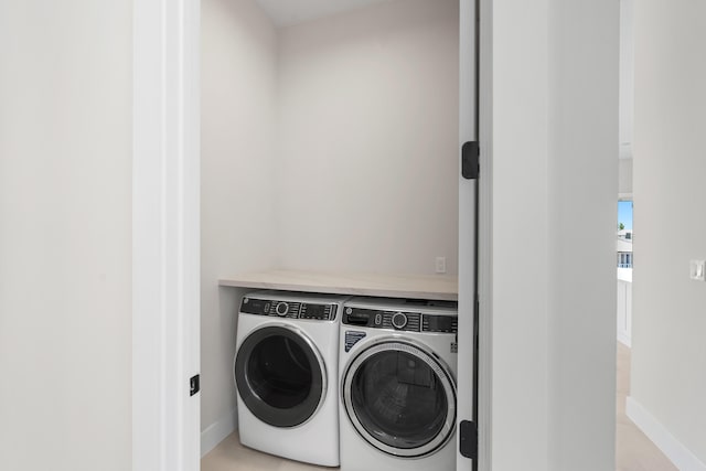 laundry room with washer and dryer