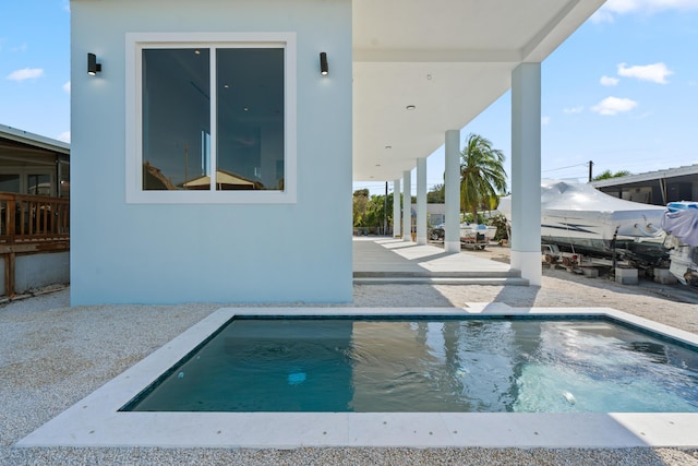 view of swimming pool featuring a patio area