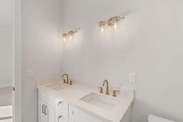 bathroom with toilet and vanity